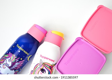 Klang,Malaysia: FEBRUARY 7, 2021- Unicorn School Bottle And Plastic Food Containers In A Row Isolated On A White Background. Tupperware Brand. Selective Focus.