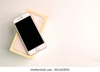 Klang,Malaysia: July 20, 2021- New iphone 8 with box isolated on white background