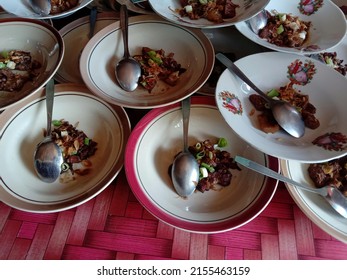 Klaten, Central Java,
Indonesia - May 2, 2022: Arrangement Of Food On Plates On The Table. Food Preparation For Invited Guests At A Simple Wedding Ceremony In Klaten.