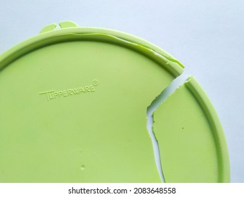 Klaten, Indonesia - November 28, 2021: Broken Tupperware Food Container Lid Isolated On White.