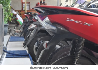 Klaten,indonesia - May 15 2021;motorcycles And Helmets In A Row Of A Parking Spot