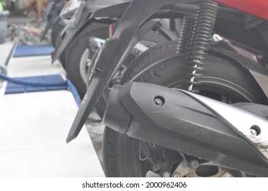 Klaten,indonesia - May 15 2021;motorcycles And Helmets In A Row Of A Parking Spot