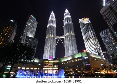 KlCC, Kuala Lumpur - 20 Oktober 2016: cityscape with colourful fountain facing Kuala Lumpur Convention Centre, KLCC in night. In picture Maxis Tower and Petronas Twin Tower