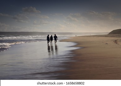 Klein Brak, South Africa, December 3, 2019 -Three Friends In A Deep Conversation On The Beach In A Very Lovely And Peaceful Environment.