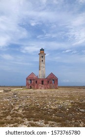 Klein Curaçao Lighthouse With A Backdrop Of Whispy Clouds And A Blue Sky