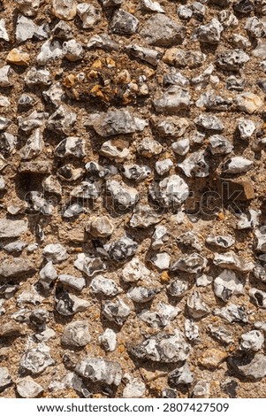 Knapped flint masonry forms a close wall texture at St Augustine's Abbey in Canterbury, Kent, England