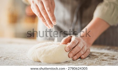 Kneading dough at the kitchen table