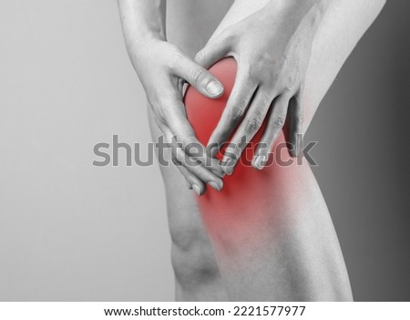 Knee cap, meniscus pain, trauma close up. Hand touching injured red kneecap. High quality photo Stock foto © 