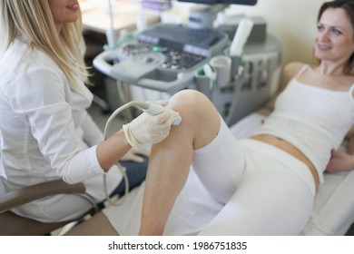 Knee joint ultrasound doctor examined the woman patient