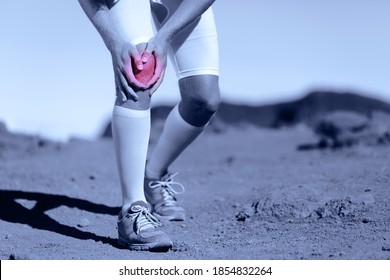 Knee Pain Athlete Sports Injury Runner Man Running On Trail Race With Sport Health Problem Holding Painful Leg. ACL Ligament Tear Is One Of The Most Common Knee Ligament Injuries.