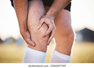 Knee pain, man with injury and fitness accident, athlete outdoor with cramps and muscle tension. Exercise, sports and male person with hands on leg, health crisis and rugby player with inflammation - Powered by Shutterstock