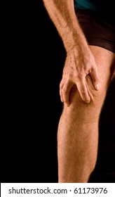 Knee pain - man massaging sore knee