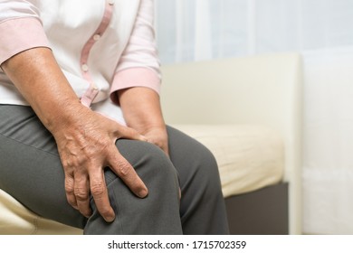 Knee Pain Of Old Woman At Home, Healthcare Problem Of Senior Concept