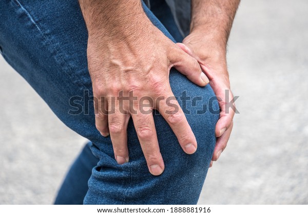 Knee sprain. Man
suffering from knee pain