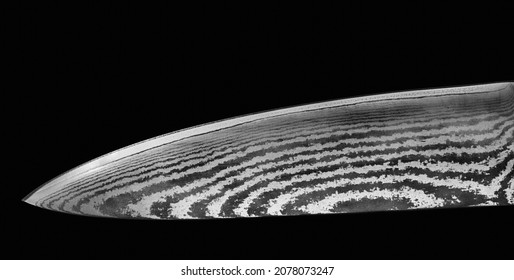 Knife blade of Damascus steel isolated on black
