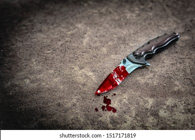 Knife With Blood Splash On Ground, Crime Murder Evidence Concept 