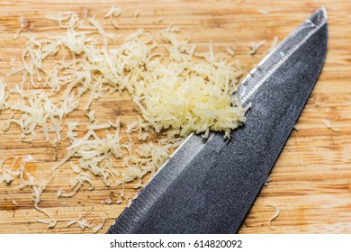 knife and cheese on a cutting board - Powered by Shutterstock