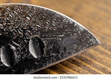 knife covered with water droplets , a wet blade of a sharp knife with a wide blade, close up - Powered by Shutterstock