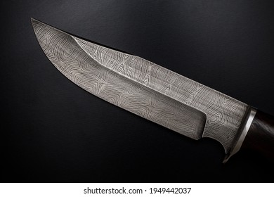 Knife of Damascus steel. Patterned blade close-up
