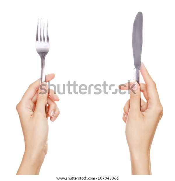 女性の手が握るナイフとフォーク 白い背景に の写真素材 今すぐ編集