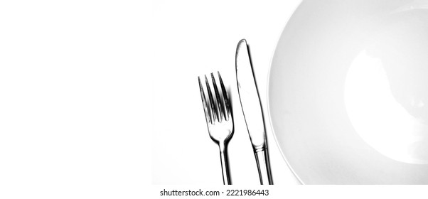 Knife And Fork Silverware With White Plate On White Background For Elegrant Eating And Fancy Food