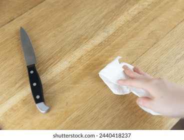 Knife on Table Cutting Board, Cleaning up Cooking, Chef, Mal Prep, Small Knives for Chopping Food in Kitchen, clean surface - Powered by Shutterstock