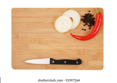 Knife, onion and pepper on cutting board isolated, cooking concept