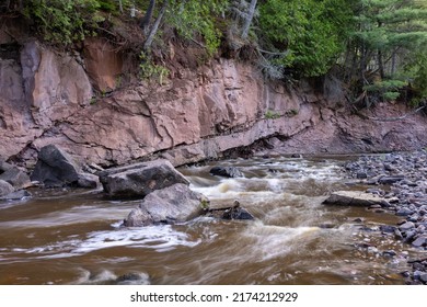 Knife River - A River Along A Rocky Hillside.