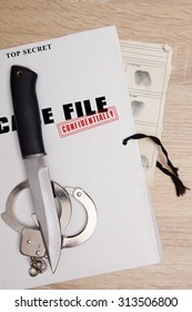 The knife from the scene on a folder with documents.