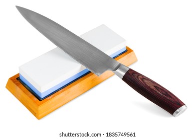 A Knife And A Sharpening Stone On White Background