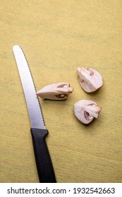 Knife With Sliced Mushrooms From Above