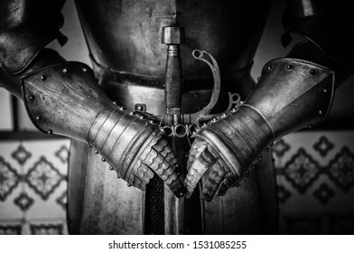 Knight Gauntlets Holding The Sword