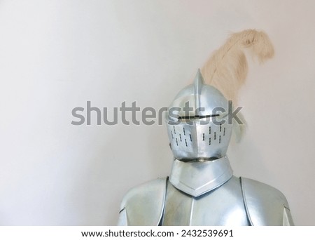 Knight, medieval suit and armor with mockup space of soldier, statue or honor on a gray studio background. Helmet, gear or equipment for battle, war or security in justice, shining silver or visor