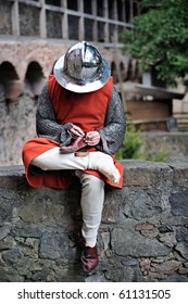 Knight Sitting On A Castle Wall