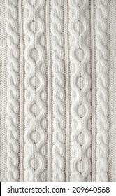 Knit Texture Of White Wool Knitted Fabric With Cable Pattern As Background