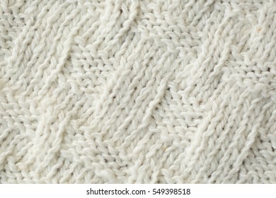 Knit Texture Of White Wool Knitted Fabric With Cable Pattern As Background