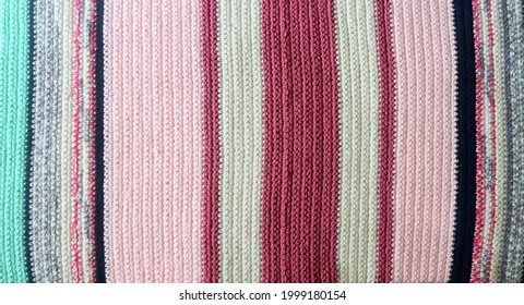Knitted background  knitted fabric  knitted texture  Soft material  Handmade carpet closeup photo  Cozy background  Knitted details  