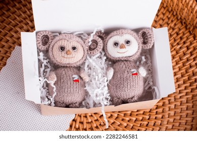 knitted brown Russian toy cheburashka with oranges. Handmade by hand made