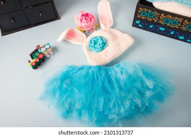 Knitted Clothes For Babies. Bunny Hat And Fluffy Blue Tulle Skirt