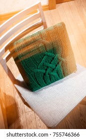 knitted cushion lying on the chair, to improve orthopedics back of the chair - Shutterstock ID 755746366