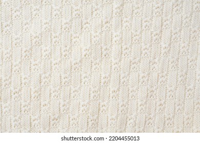 Knitted Fabric Texture. Close-up Of A Piece Of Knit Fabric. White Knitted Fabric Texture.