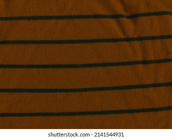 Knitted Natural Textile Brown Sweater Texture. Texture Of A Knitted Brown Vermillion Sweater With Horizontal Strips.