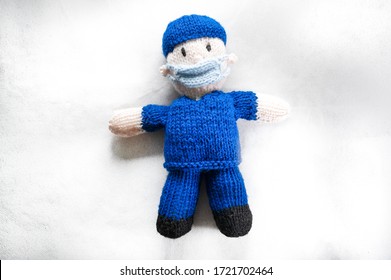 Knitted Nurse, Front Line Worker On White Background. Covid 19