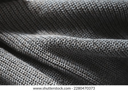 knitted sweater texture.  gray knitted fabric background.