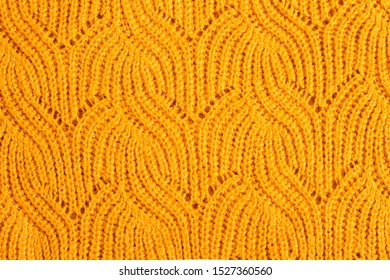 Knitted Texture Of An Orange Sweater. Background Of Orange Textured Sweaters. Fall Background