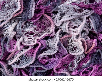 Knitted Texture From A Woolen Purple Scarf. Knitting, Crocheting. Waves, Shuttlecocks. Beautiful Drapery, Folds. Boa.