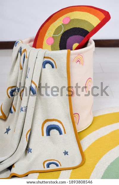 knitted\
throw cushion basket rugs rainbow theme\
textile