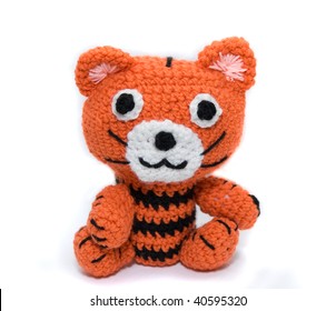 Knitted Toy Tiger On A White Background