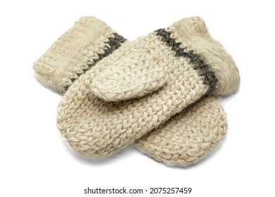 Knitted warm woolen mittens on a white background