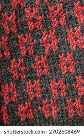 Knitted Wool Fabric Pattern in Red and Dark Grey – Cozy Textile Close-Up
